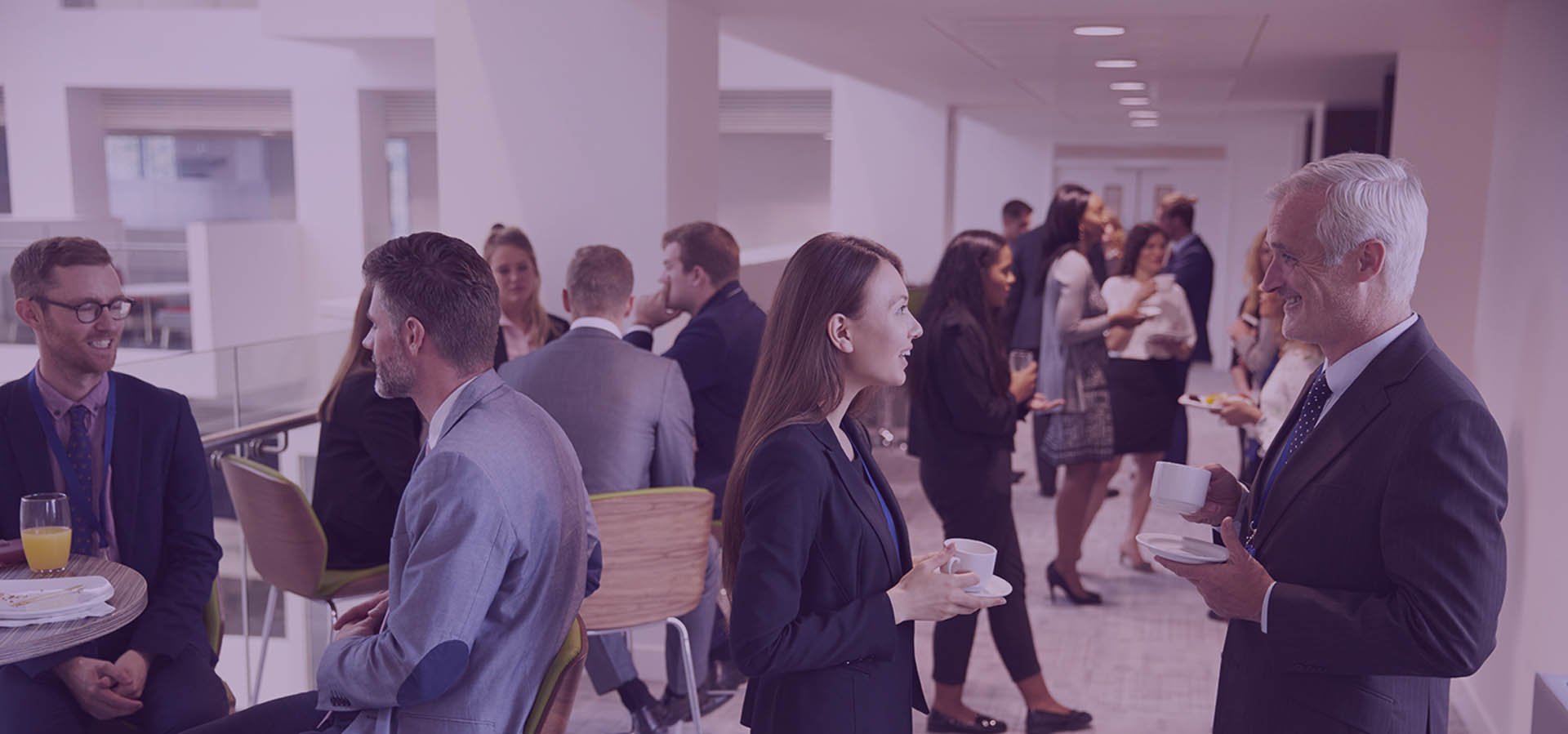 Delegates Networking During Coffee Break At Conference